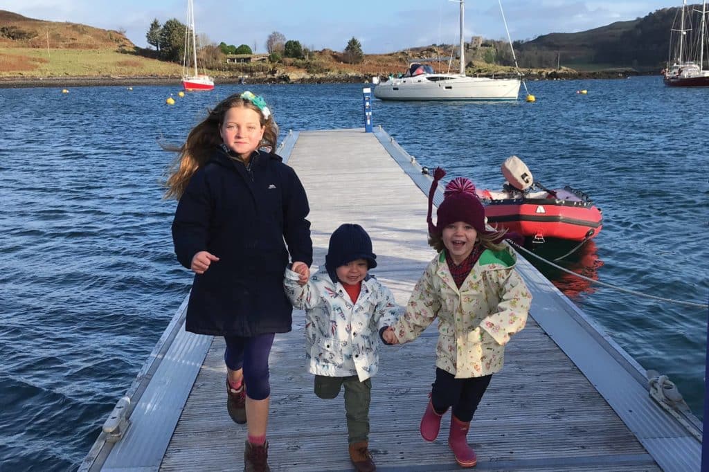 kids running on a dock