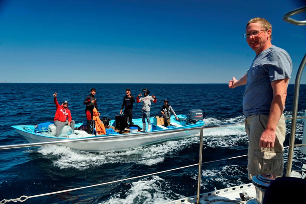 Scallop fisherman in a small boat