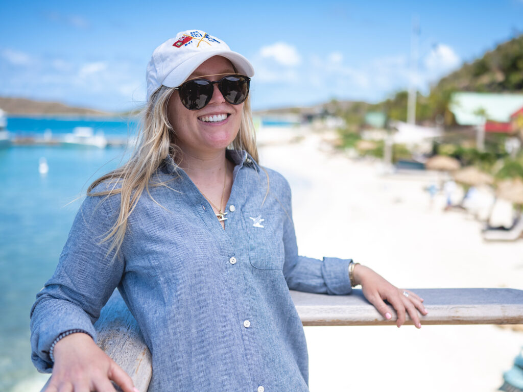 Person on a balcony that overlooks the beach