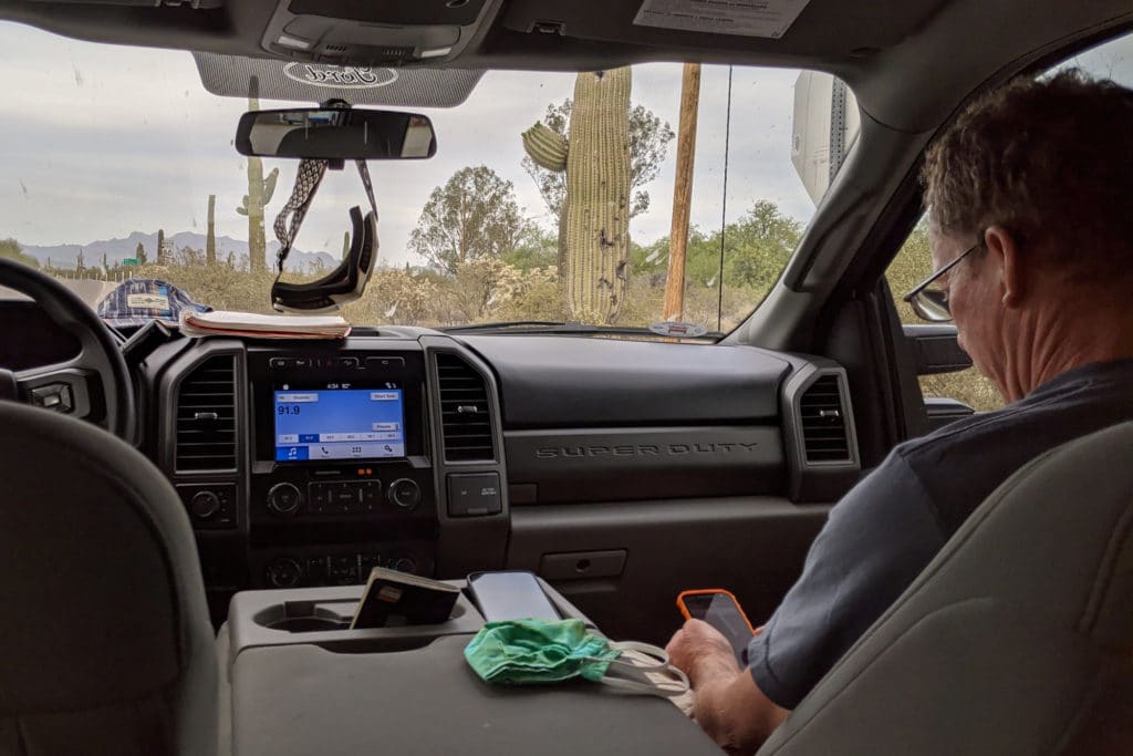 person sitting in the passenger seat of a truck